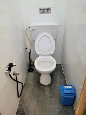 a bathroom with a white toilet in a stall at Ria Serene Homestay in Sungai Petani