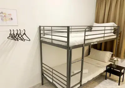 a couple of bunk beds in a room at Ria Serene Homestay in Sungai Petani