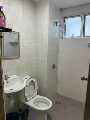a bathroom with a toilet and a sink at AYAAN FIFA HOME at Quintet Private Parking in Tanah Rata