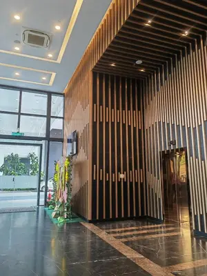 a lobby with a black and white striped wall at Urban Suite in George Town