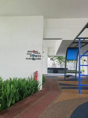 a sign on the side of a building with plants at Urban Suite in George Town