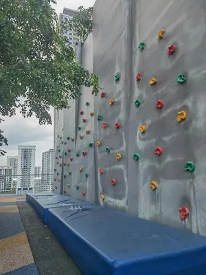 a retaining wall with a rock climbing wall at Urban Suite in George Town