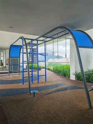 an empty playground with blue swings at Urban Suite in George Town