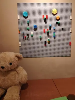 a teddy bear sitting in front of a lego wall at Mokū Georgetown Pre-war House 4BR 5-14pax in George Town