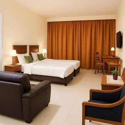 a hotel room with a bed and a couch at Home2Stay at Marina Island in Lumut