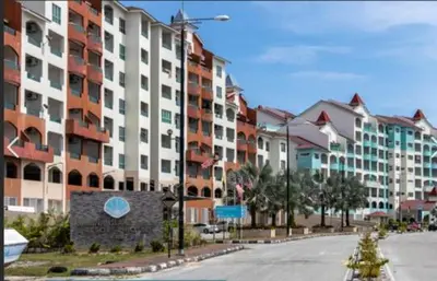 an empty street in a city with tall buildings at Home2Stay at Marina Island in Lumut