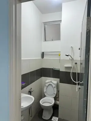 a small bathroom with a toilet and a sink at AYAAN Fifa Game HOMESTAY At Tanah Rata with Wifi in Tanah Rata
