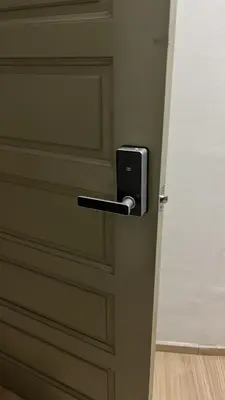 a door with a metal handle on a door at Imagine world quintet apartment in Tanah Rata