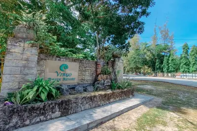 a sign for the mgm garden resort at Virgo Batik Resort, Teluk Batik in Lumut