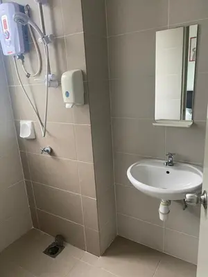 a bathroom with a sink and a shower at Golden Hills 2 Bedroom Apartment in Brinchang