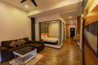 a living room with a couch and a bed at Nova Cameron Glamz in Cameron Highlands