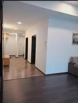 an empty living room with a couch and wooden floors at Nova Cameron Glamz in Cameron Highlands