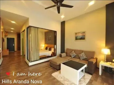 a living room with a couch and a bed at Nova Cameron Glamz in Cameron Highlands