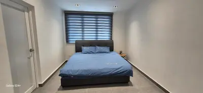 a small bedroom with a bed and a window at Canning Home in Ipoh