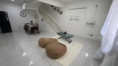 a living room with a bean bag chair and a staircase at Memoir Perda in Bukit Mertajam