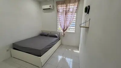 a small bedroom with a bed and a window at Memoir Perda in Bukit Mertajam