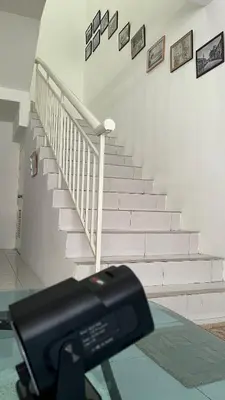 a view of a stairway with a camera on a glass table at Memoir Perda in Bukit Mertajam