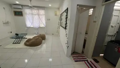 a room with a dog laying on the floor at Memoir Perda in Bukit Mertajam