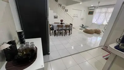 a kitchen and dining room with a table and chairs at Memoir Perda in Bukit Mertajam