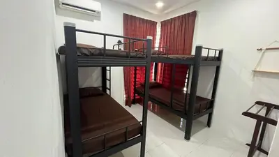 two sets of bunk beds in a room at Memoir Perda in Bukit Mertajam