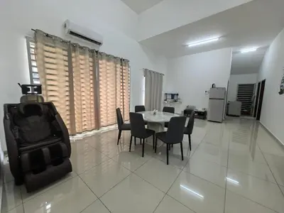 a dining room with a table and chairs at Padang Serai Taman Ria 61 in Padang Serai