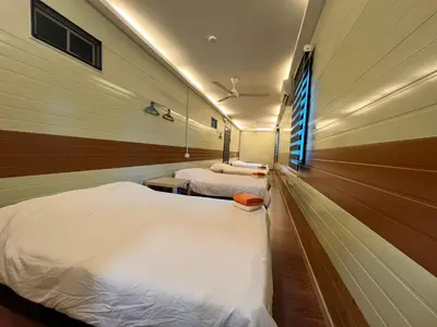 a hospital room with two beds and a window at Ting Brother Sg Klah Inn in Sungkai