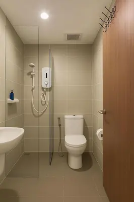 a bathroom with a shower and a toilet and a sink at 2 Connecting Room, Kozi Square in Gua Sai