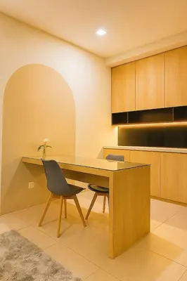a kitchen with a wooden table and two chairs at 2 Connecting Room, Riverine Diamond in Gua Sai