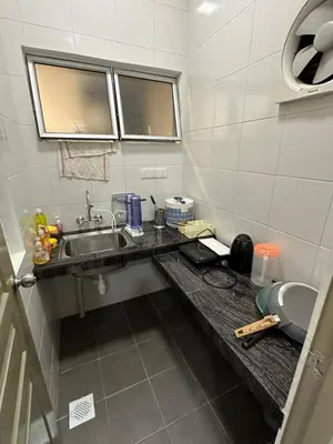 a kitchen with a sink and a counter with a sink at Ayaan Gaming Home 2 Experience Real Life Simulator Racing Games in Tanah Rata