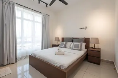a bedroom with a large bed and a large window at Simple Bali l Projector l Netflix l 2 parking in Ipoh
