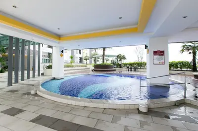 a swimming pool in the middle of a building at Simple Bali l Projector l Netflix l 2 parking in Ipoh