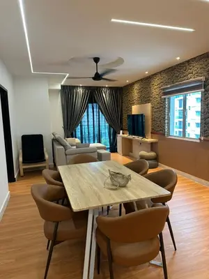 a living room with a dining table and chairs at Adik Aisyah black forest luxury cameron homestay in Tanah Rata