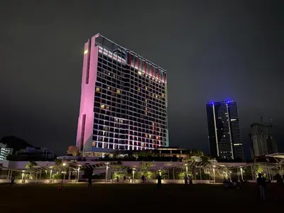 a tall building lit up in pink and blue at SPICE Skyview Luxe Tunas 4B3B in Bayan Lepas