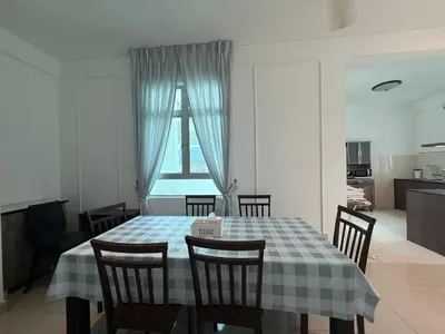 a dining room with a table with chairs and a window at SPICE Skyview Luxe Tunas 4B3B in Bayan Lepas