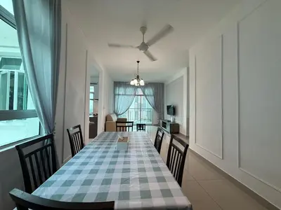 a dining room with a long table and chairs at SPICE Skyview Luxe Tunas 4B3B in Bayan Lepas