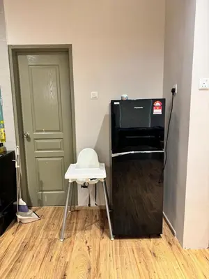 a room with a television and a stool in front of a door at Ayaan Snookers House 2 at Quintet Cameron Highland in Tanah Rata
