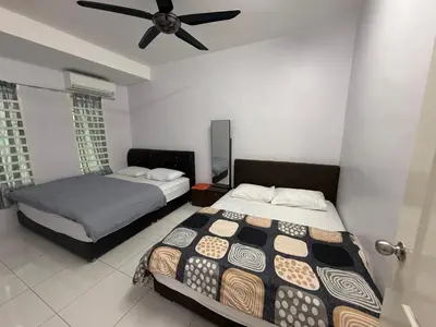 a bedroom with two beds and a ceiling fan at DND Homestay Sitiawan in Sitiawan