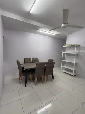 a dining room with a table and chairs in a room at DND Homestay Sitiawan in Sitiawan