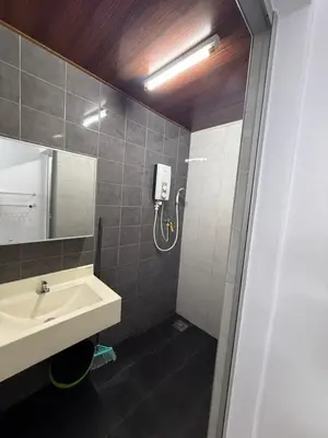 a bathroom with a sink and a shower at DND Homestay Sitiawan in Sitiawan