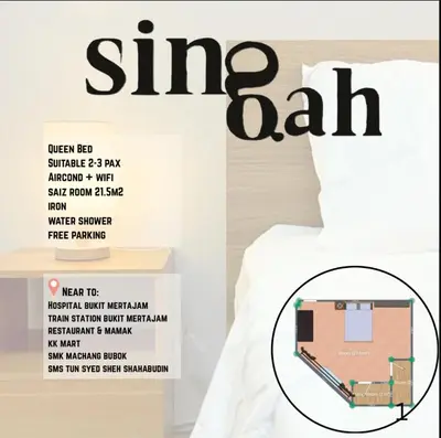 a bed with a sign that reads sing bat at Singah in Bukit Mertajam