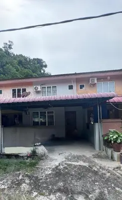 a house with a red awning in front of it at Homestay Pangkor Ann in Pangkor