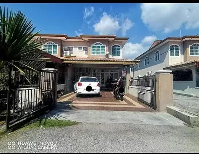 a white car parked in front of a house at Homestay Manjung Ann in Seri Manjung