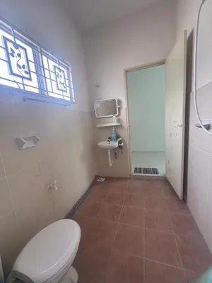 a bathroom with a toilet and a sink at Homestay Manjung Ann in Seri Manjung