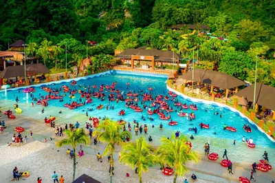 an overhead view of a large swimming pool at a resort at Golden Roof Hotel Sunway Ipoh in Ipoh