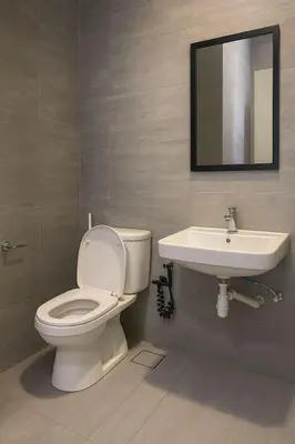 a bathroom with a toilet and a sink at 2 Connecting Room, Riverine Diamond, 5A & 5B in Gua Sai