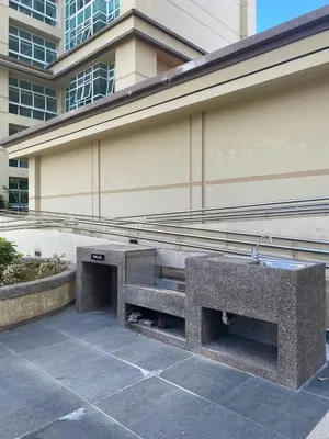 a stone bench in front of a building at 2 Connecting Room, Riverine Diamond, 5A & 5B in Gua Sai
