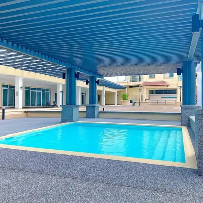 a swimming pool in front of a building at 2 Connecting Room, Riverine Diamond, 5A & 5B in Gua Sai