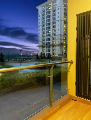 a balcony with a view of a building at 2 Connecting Room, Riverine Diamond, 5A & 5B in Gua Sai