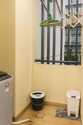 a bathroom with a toilet in front of a window at 2 Connecting Room, Riverine Diamond, 5A & 5B in Gua Sai