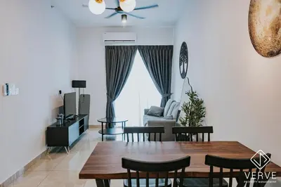 a dining room and living room with a table and chairs at Ipoh Town ICC Premium Suites by Verve 2B2B in Ipoh